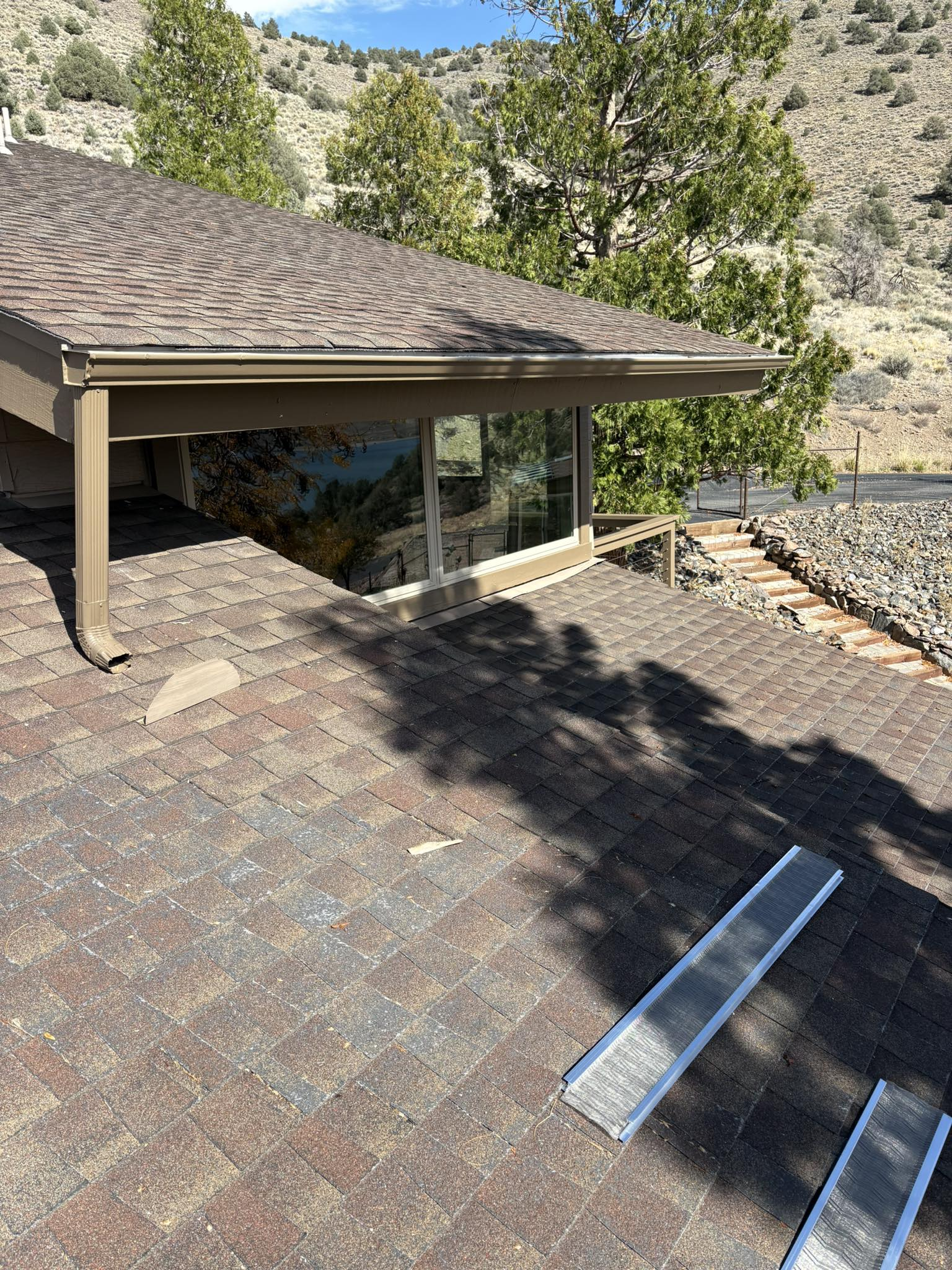 Gutter installation on shingled roof